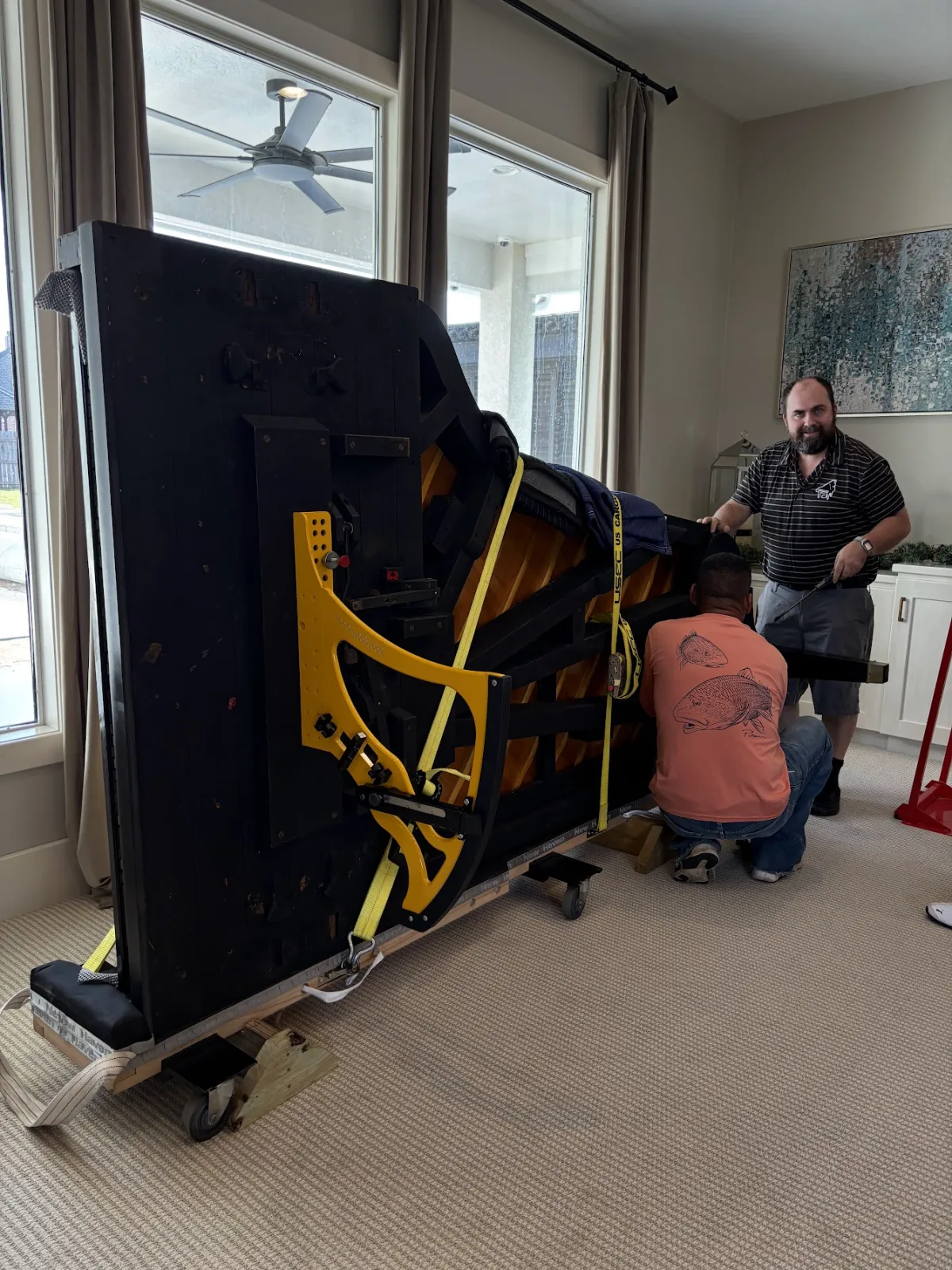 Cody Handlin moving a grand piano with the Moondog Tilter