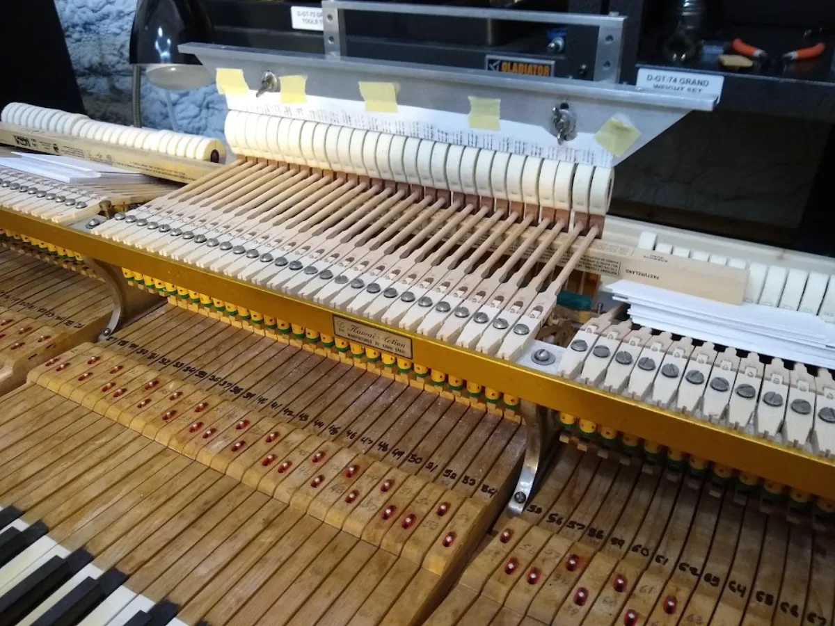 Inside an upright piano during tuning and repair