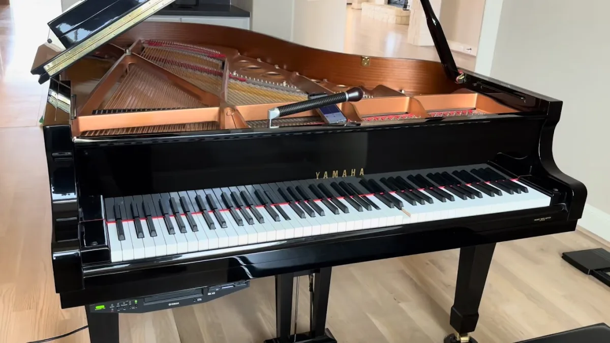 Yamaha grand piano being tuned